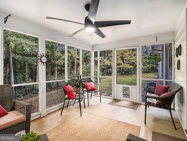 sunroom with a wealth of natural light and ceiling fan