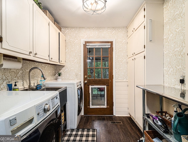 laundry area featuring cabinet space, visible vents, dark wood-type flooring, independent washer and dryer, and wallpapered walls