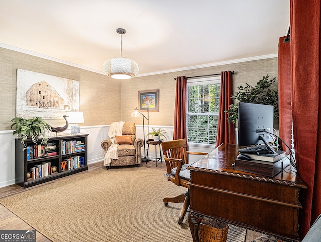 office with a wainscoted wall, ornamental molding, wood finished floors, and wallpapered walls