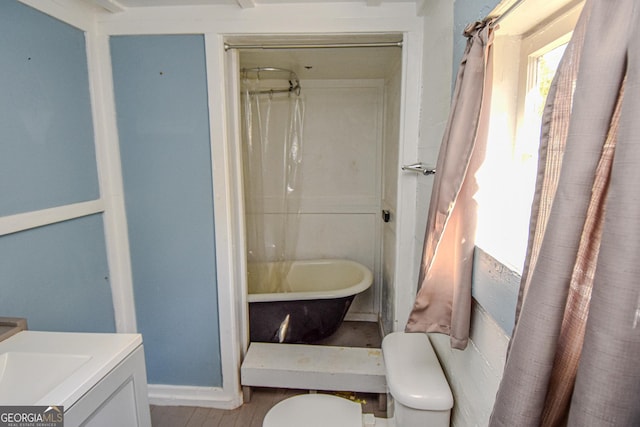 full bathroom with vanity, toilet, plus walk in shower, and hardwood / wood-style flooring