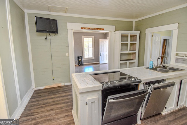 kitchen with tile countertops, white cabinetry, sink, and dark wood-type flooring