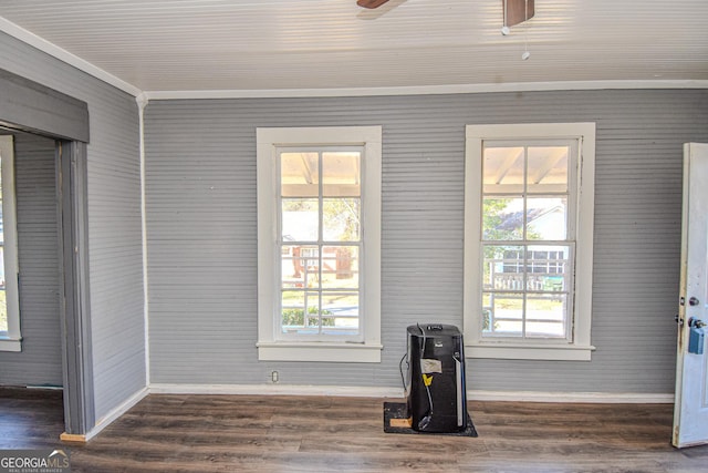 interior space with ceiling fan, wood-type flooring, and ornamental molding