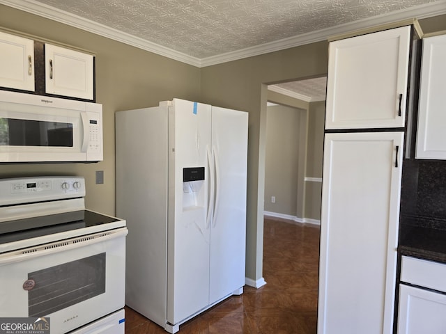 kitchen with white cabinets, a textured ceiling, white appliances, and ornamental molding