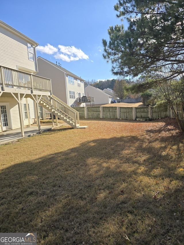 view of yard with a wooden deck