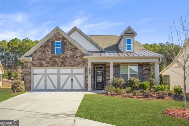 view of front of home featuring a garage and a front yard