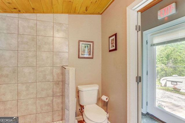 bathroom featuring wood ceiling, vaulted ceiling, and toilet