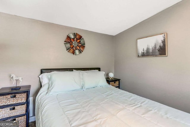 bedroom featuring lofted ceiling