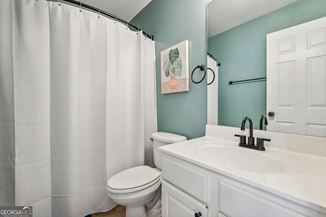 full bathroom with vanity, toilet, and tile patterned floors