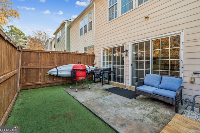 view of patio / terrace featuring a fenced backyard and a grill