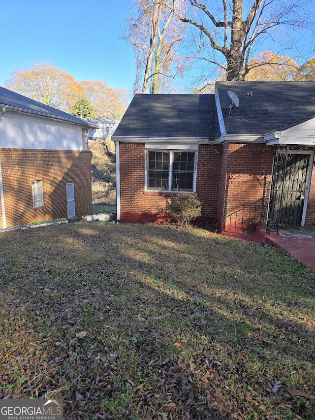 view of home's exterior featuring a lawn