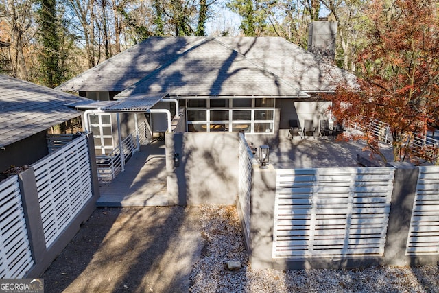 exterior space featuring a patio area and a sunroom