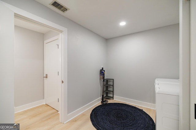 interior space featuring washer and dryer and hardwood / wood-style flooring