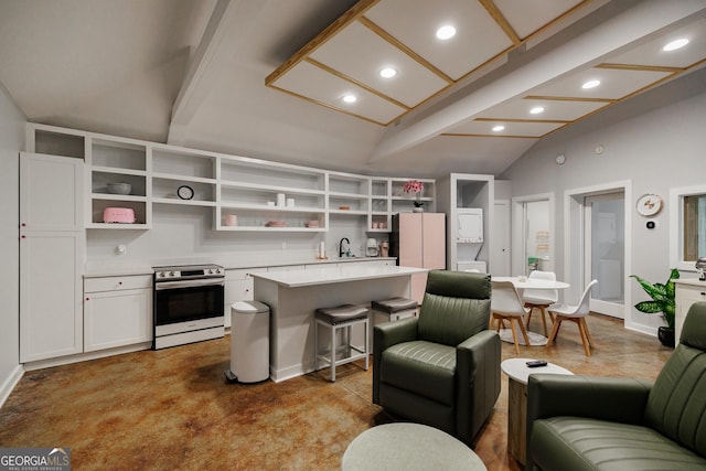 kitchen featuring white cabinetry, a center island, lofted ceiling with beams, white fridge, and stainless steel range with electric cooktop