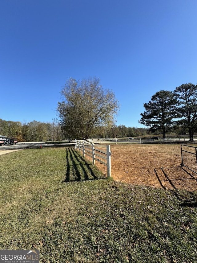 view of yard with a rural view