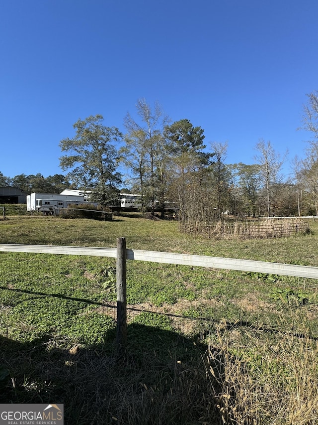 view of yard with a rural view