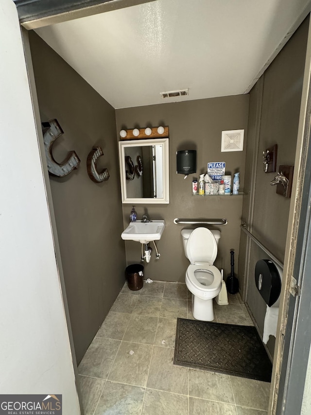 bathroom with toilet and sink