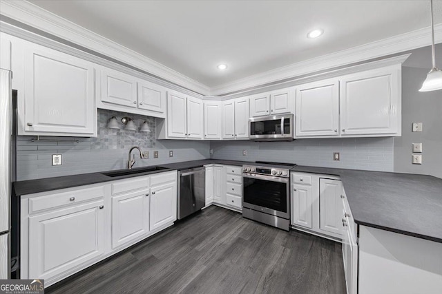 kitchen with white cabinets, stainless steel appliances, tasteful backsplash, and sink