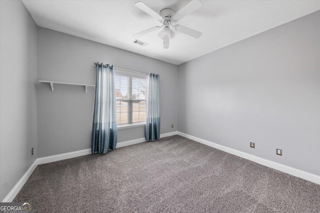 unfurnished room with carpet, a textured ceiling, and ceiling fan