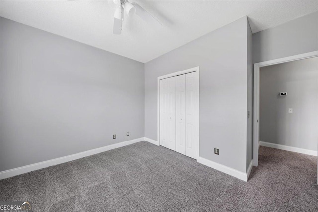 unfurnished bedroom with carpet, ceiling fan, and a closet