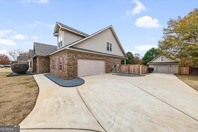 view of side of home with a garage and a yard