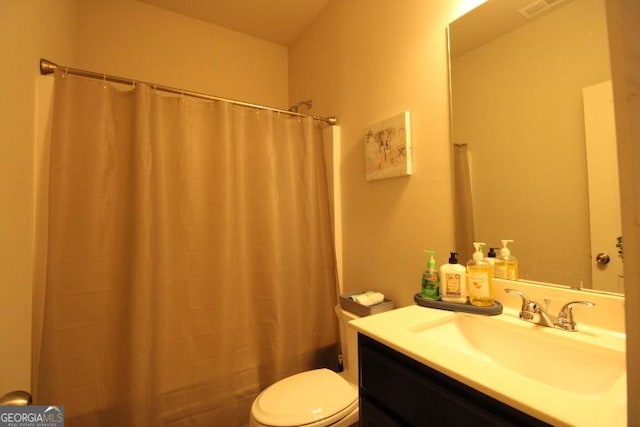 bathroom with vanity and toilet