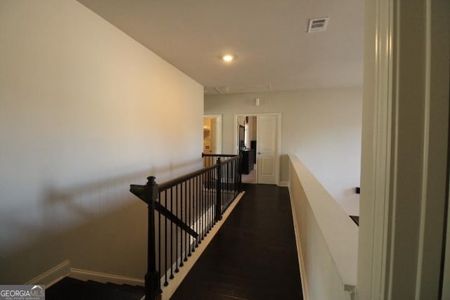 stairs featuring hardwood / wood-style flooring