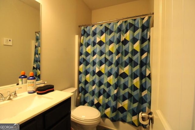 full bathroom featuring vanity, shower / bath combination with curtain, and toilet