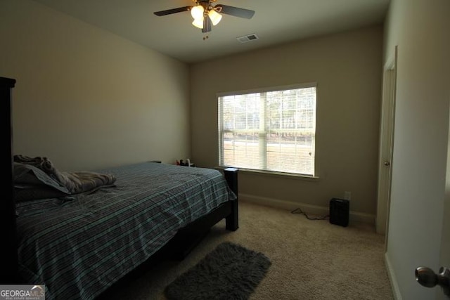 carpeted bedroom featuring ceiling fan