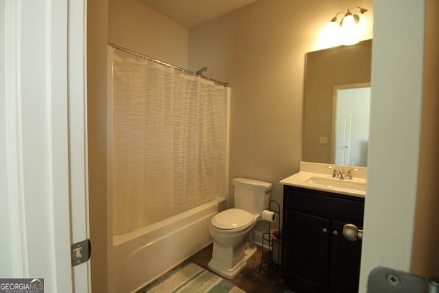 full bathroom with vanity, toilet, and shower / tub combo with curtain