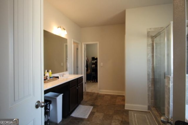 bathroom with vanity and walk in shower