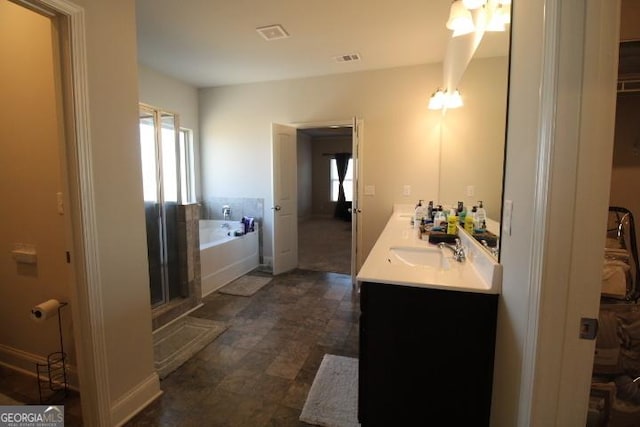 bathroom featuring plus walk in shower and vanity