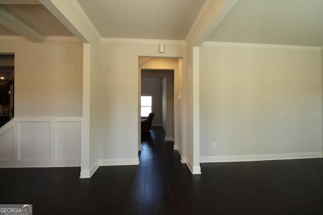 hallway with crown molding and dark hardwood / wood-style floors