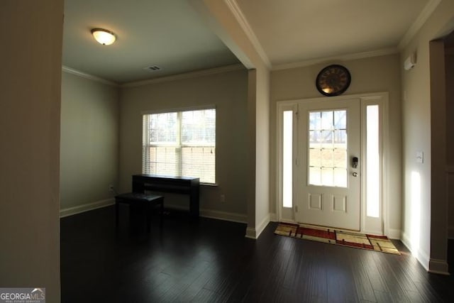 entryway with plenty of natural light, crown molding, and dark wood-type flooring