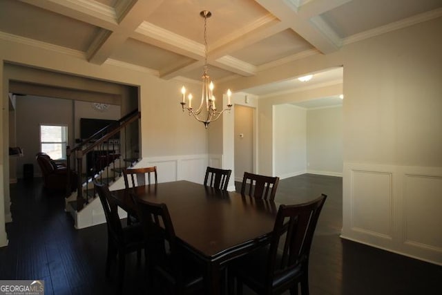 dining area featuring coffered ceiling, dark hardwood / wood-style floors, ornamental molding, a notable chandelier, and beam ceiling