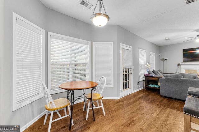 dining room featuring hardwood / wood-style flooring and ceiling fan