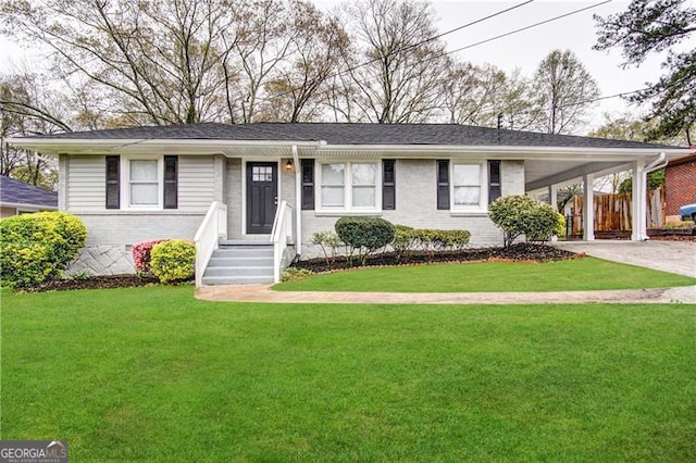 ranch-style house with a carport and a front lawn