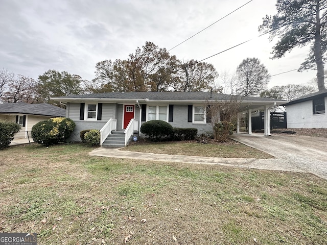 view of front facade featuring a carport and a front yard