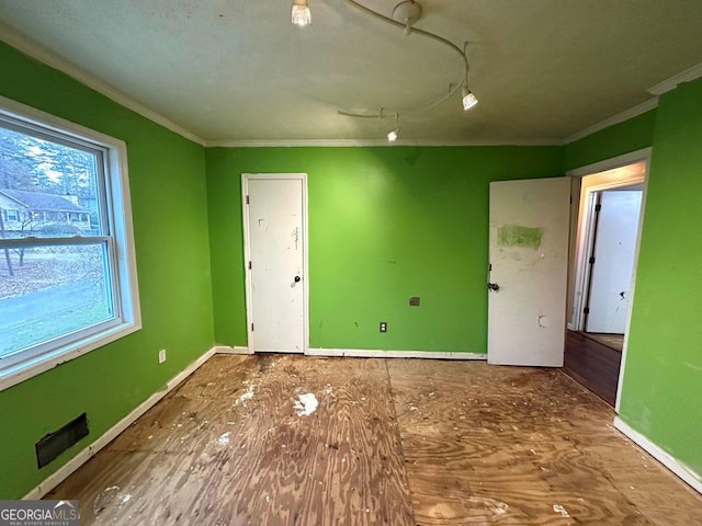 spare room featuring ornamental molding