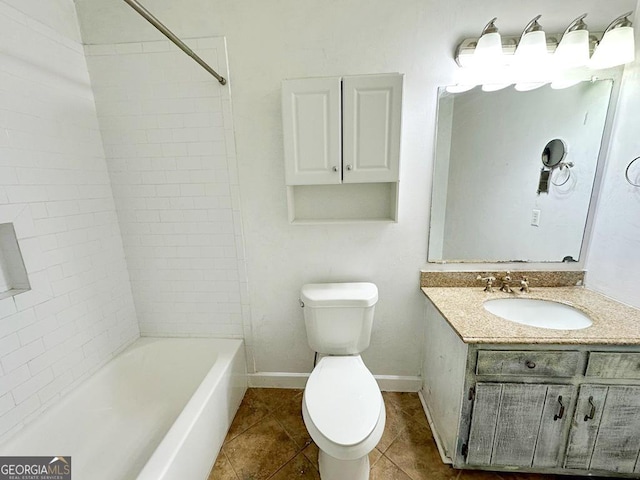 full bathroom with vanity, tiled shower / bath, tile patterned floors, and toilet