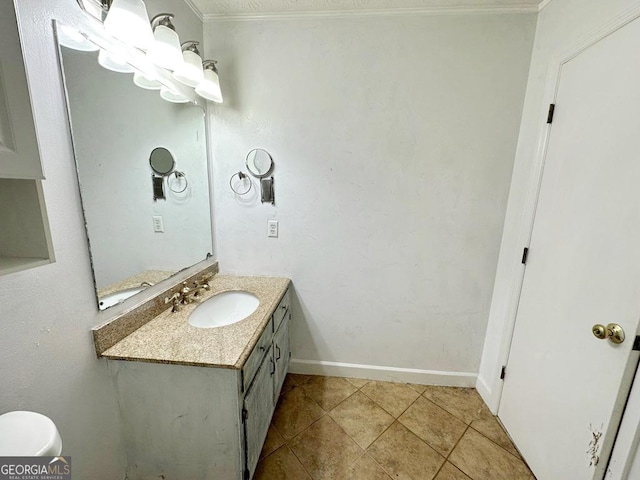 bathroom with vanity, tile patterned flooring, and crown molding