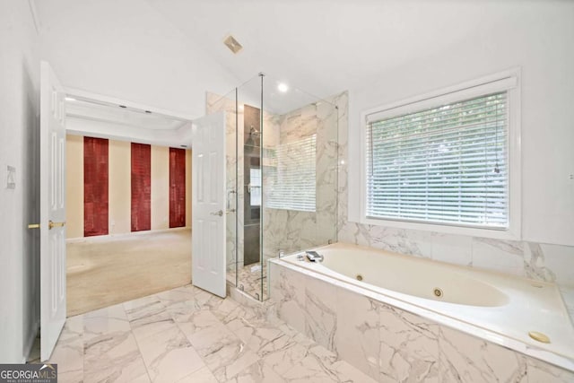 bathroom featuring separate shower and tub and vaulted ceiling