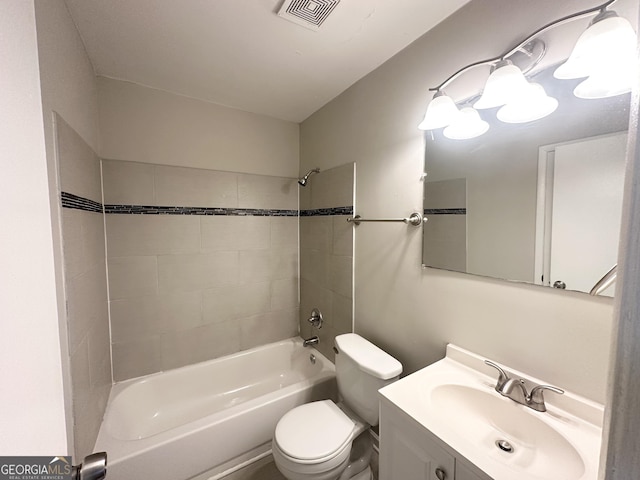 full bathroom with vanity, toilet, and tiled shower / bath