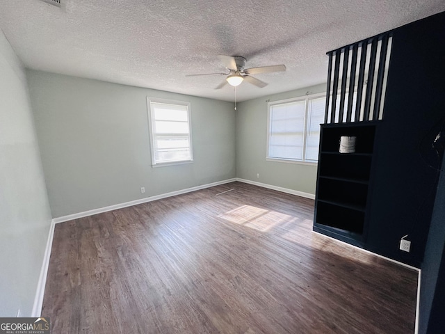 3039 Albany Ave, Waycross, GA 31503 - unfurnished bedroom featuring wood finished floors, a textured ceiling, baseboards, and a ceiling fan