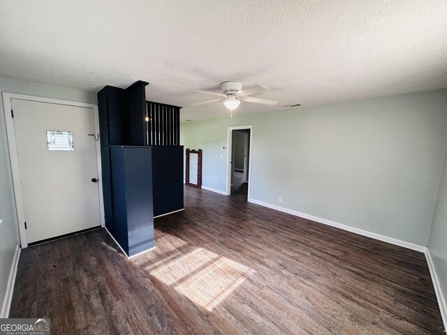 3039 Albany Ave, Waycross, GA 31503 - spare room featuring wood finished floors, baseboards, ceiling fan, and a textured ceiling