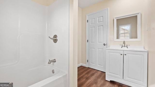 bathroom featuring vanity, shower / bath combination, and hardwood / wood-style flooring