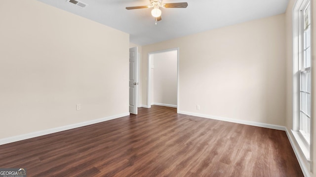 empty room with hardwood / wood-style flooring and ceiling fan