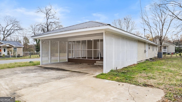 view of side of property with cooling unit