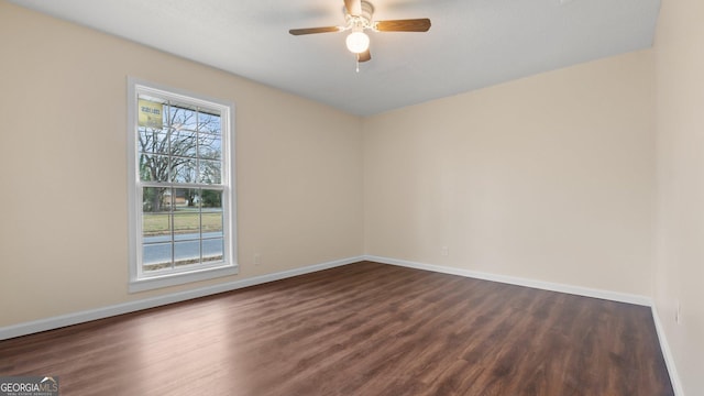 unfurnished room featuring dark hardwood / wood-style floors and ceiling fan