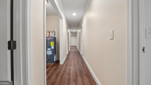 hallway with electric water heater and dark wood-type flooring