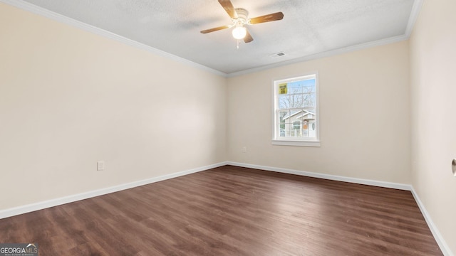 unfurnished room featuring a textured ceiling, ornamental molding, and dark wood-type flooring